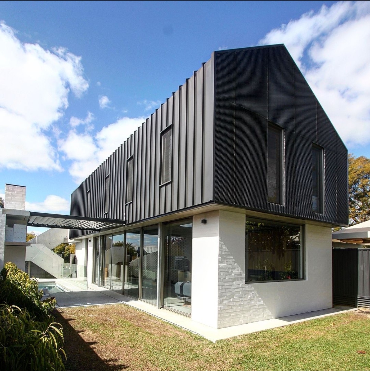 Contemporary black-clad residence